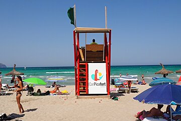 a lifeguard tower on a beach in mallorca
