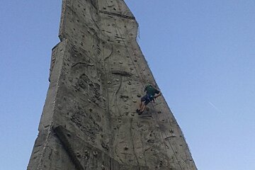 an outdoor rock wall in 2 Alpes