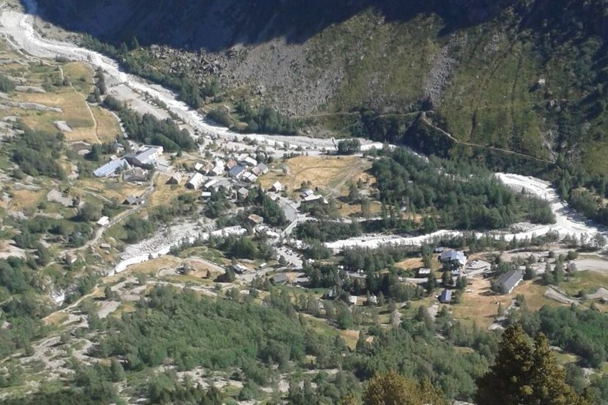 a view over a village from a climbing route