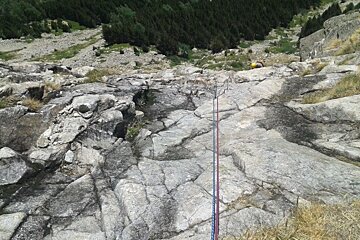 climbing ropes on a rock face