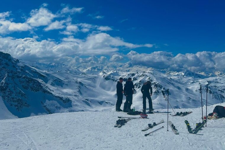 Sunny day on the slopes looking down over Courchevel