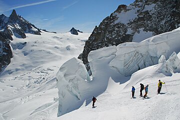 A group of people skiing down a snowy mountain