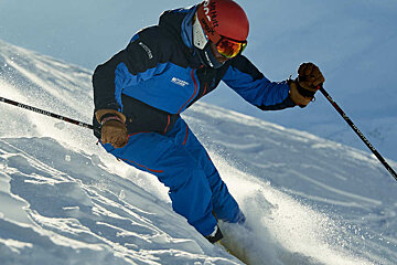 a ski instructor giving a group lesson