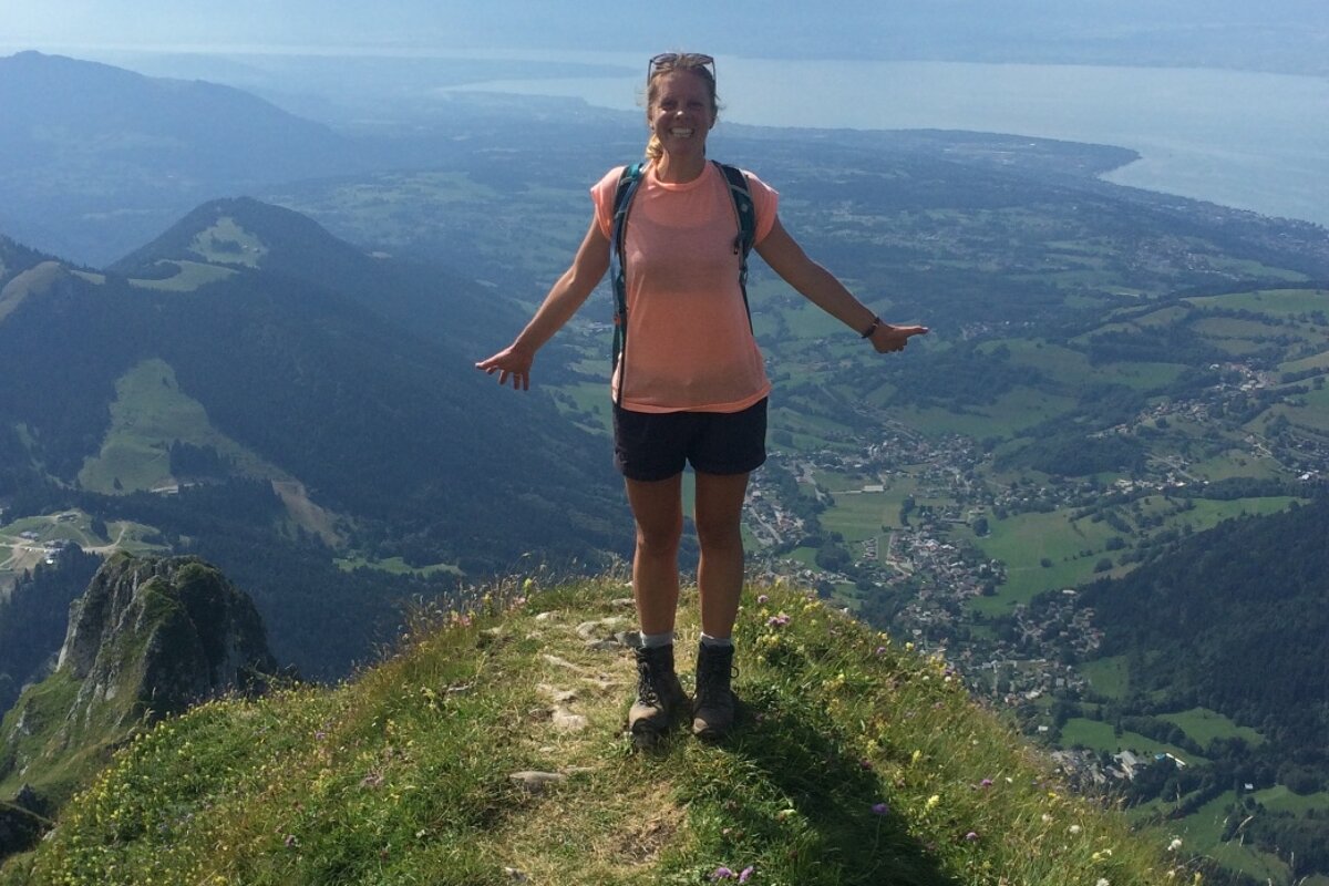 a woman on a mountain trail