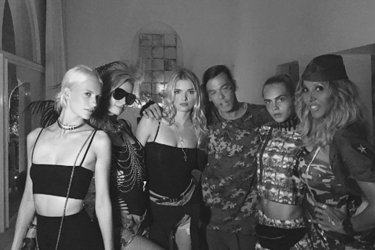 A black and white photo of a group of people posing for a picture