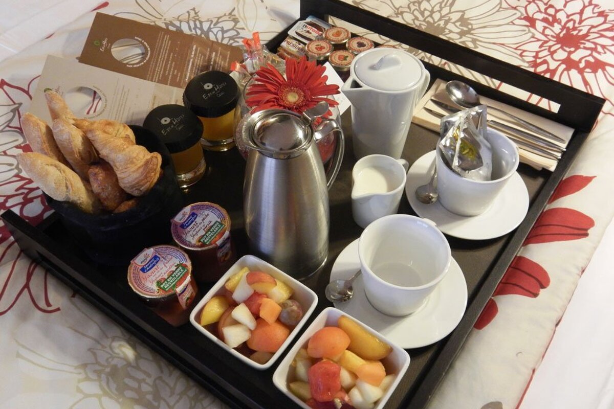 A tray of food including a jar that says ' creme fraiche ' on it
