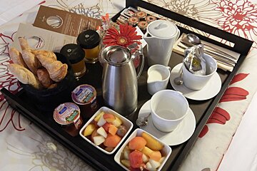 A tray of food including a jar that says ' creme fraiche ' on it