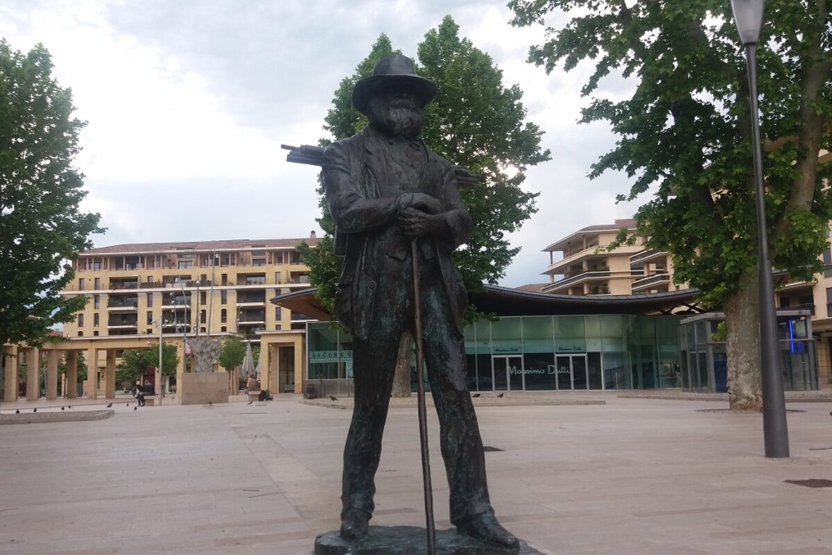 a bronze statue of paul cezanne