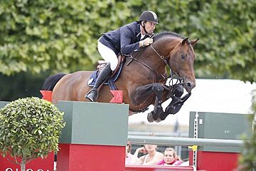 horse and rider over large jump