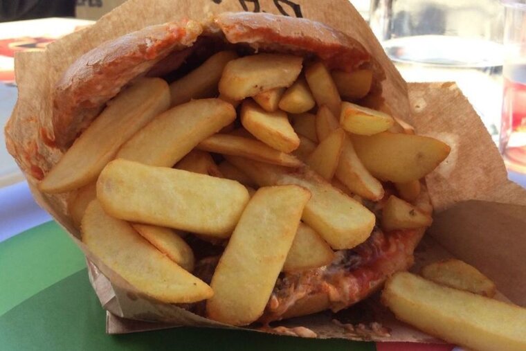 burger with chips in the bun
