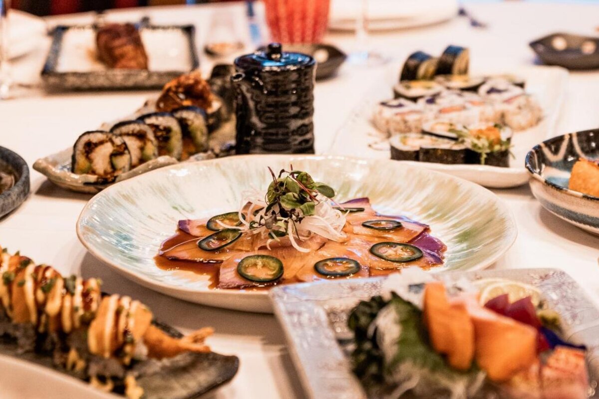 A plate of food with jalapenos on it sits on a table