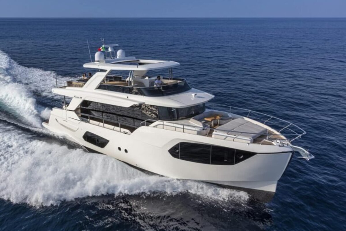 A large white yacht is floating in the ocean