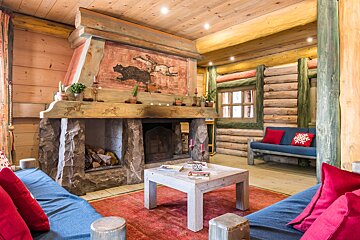 A living room with a fireplace and a couch
