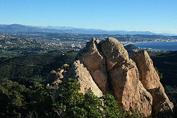 A view of a city from the top of a mountain