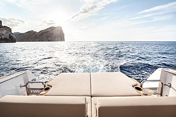 The back of a boat with the word clouds on it