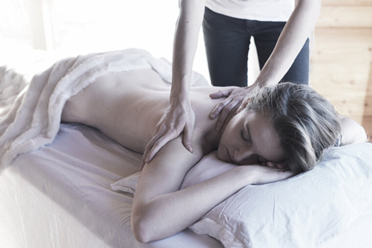 a woman getting a back massage