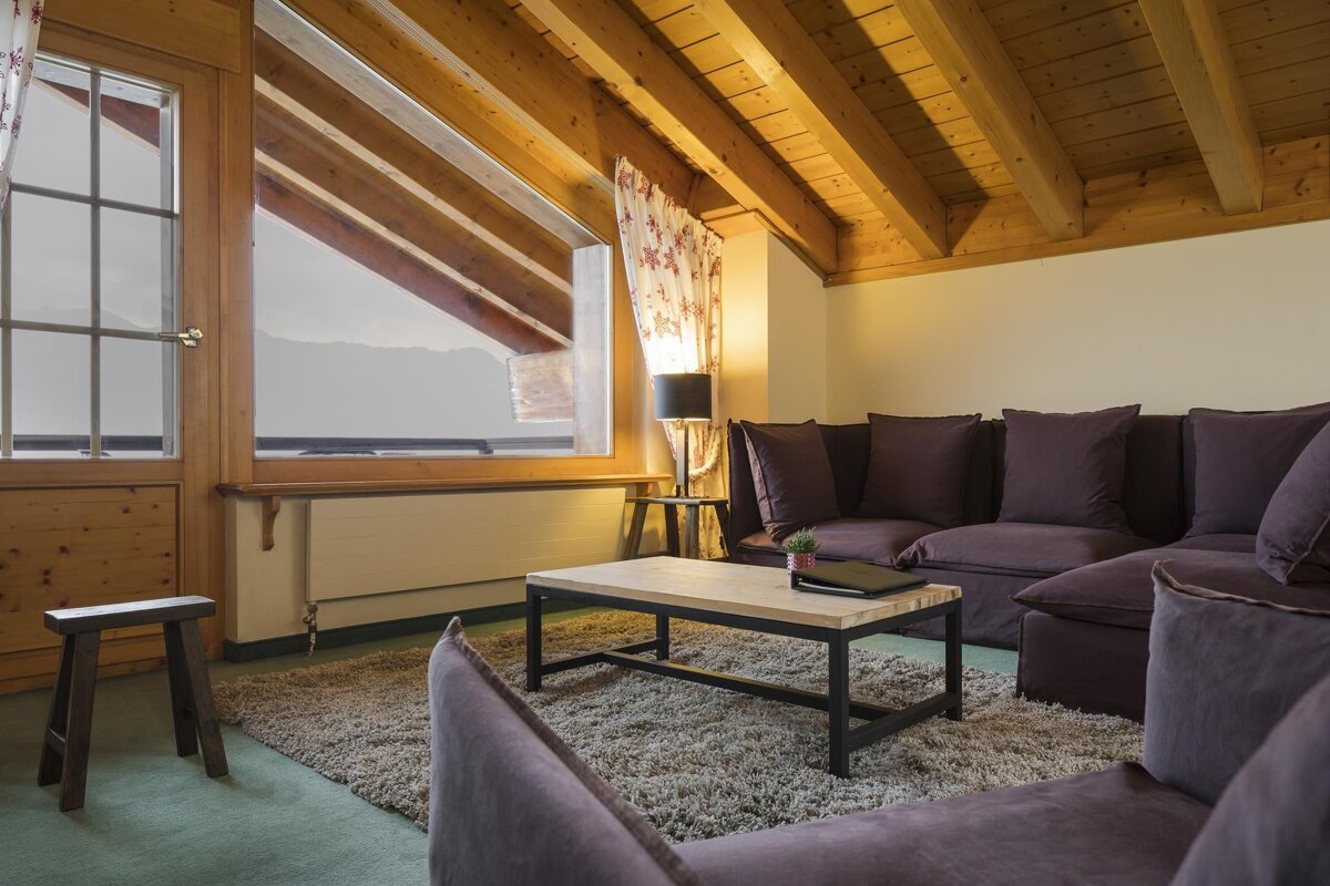 A living room with a couch and a coffee table