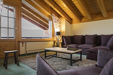 A living room with a couch and a coffee table