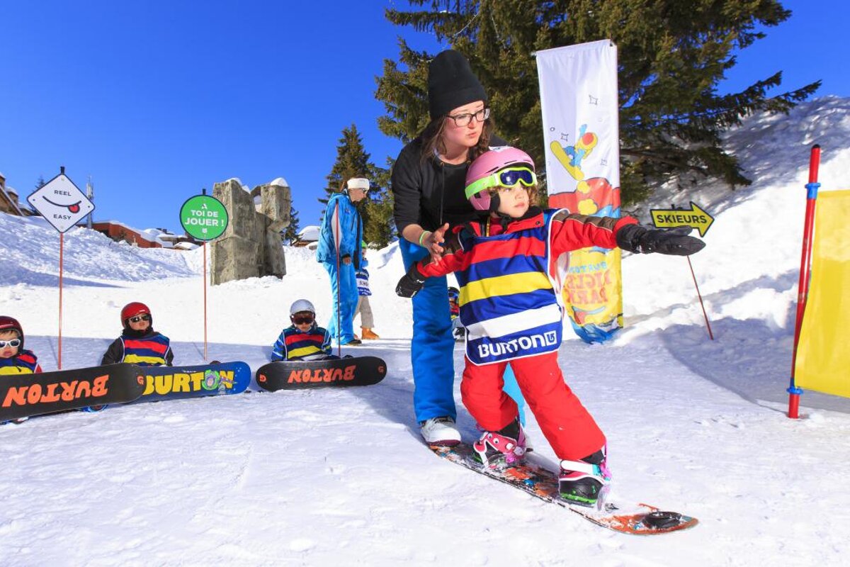 a young snowboarder learning to ride