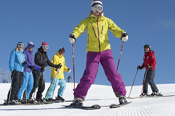 a ski instructor giving a group lesson