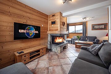 A living room with a flat screen tv that says universal
