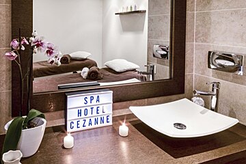 A bathroom with a sign that says spa hotel cezanne