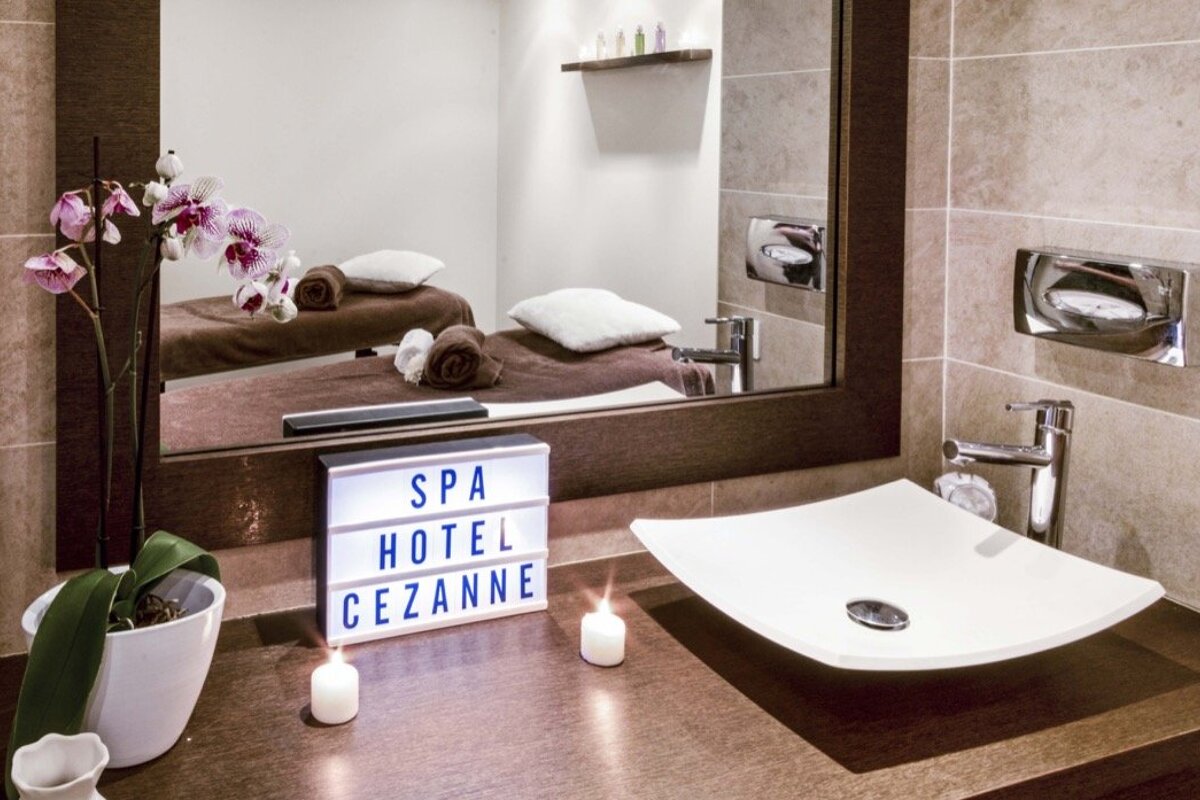 A bathroom with a sign that says spa hotel cezanne