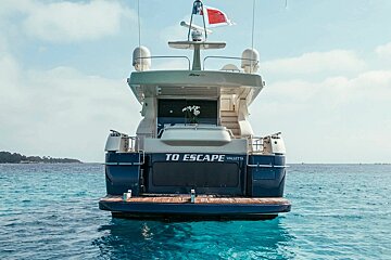 A boat that says to escape on the back of it