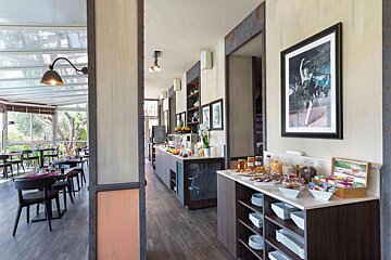 A picture of a woman riding a bike hangs on a wall in a restaurant