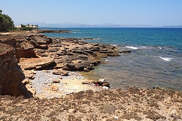 a rocky cove on the coast of mallorca