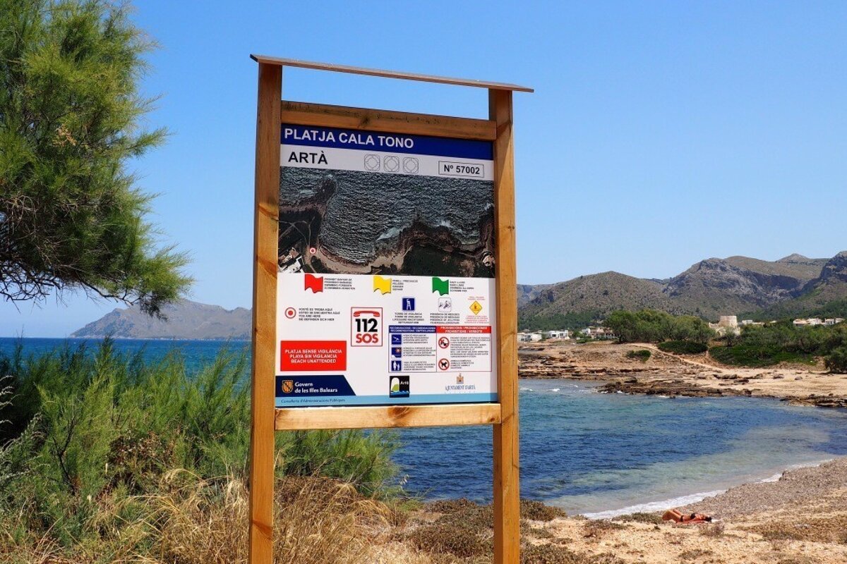 a sign at a beach in mallorca