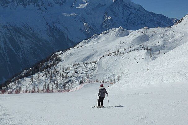 a lone skier in the brevent ski area