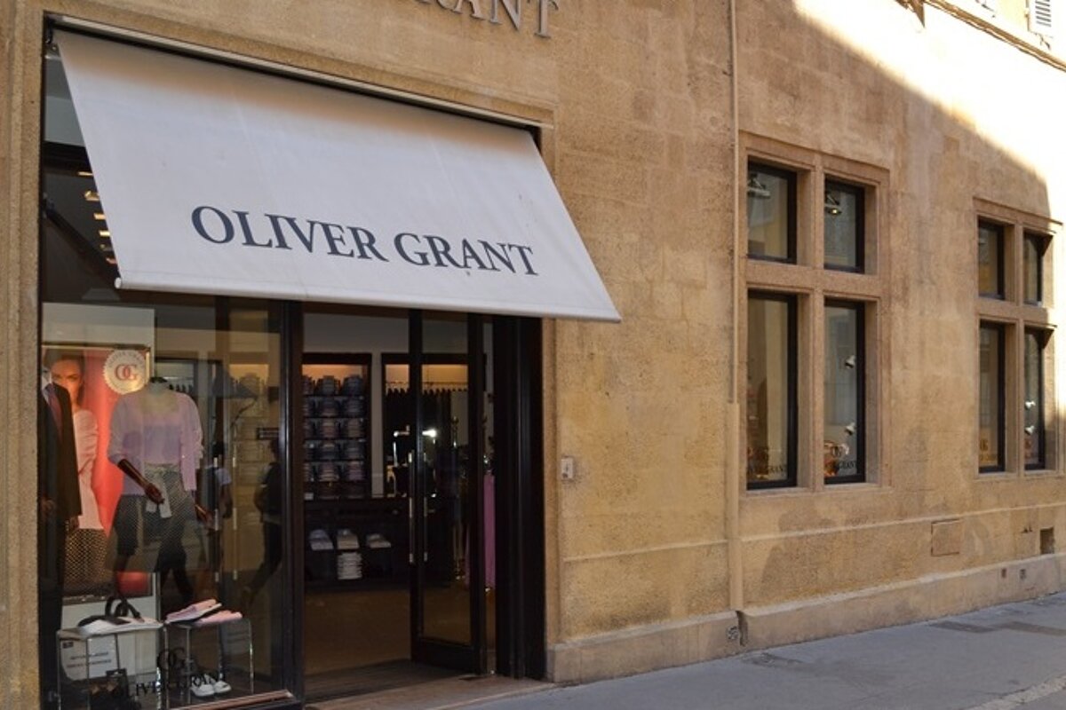 image of shop front with brick walls on the side and display in the window