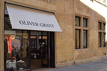 image of shop front with brick walls on the side and display in the window