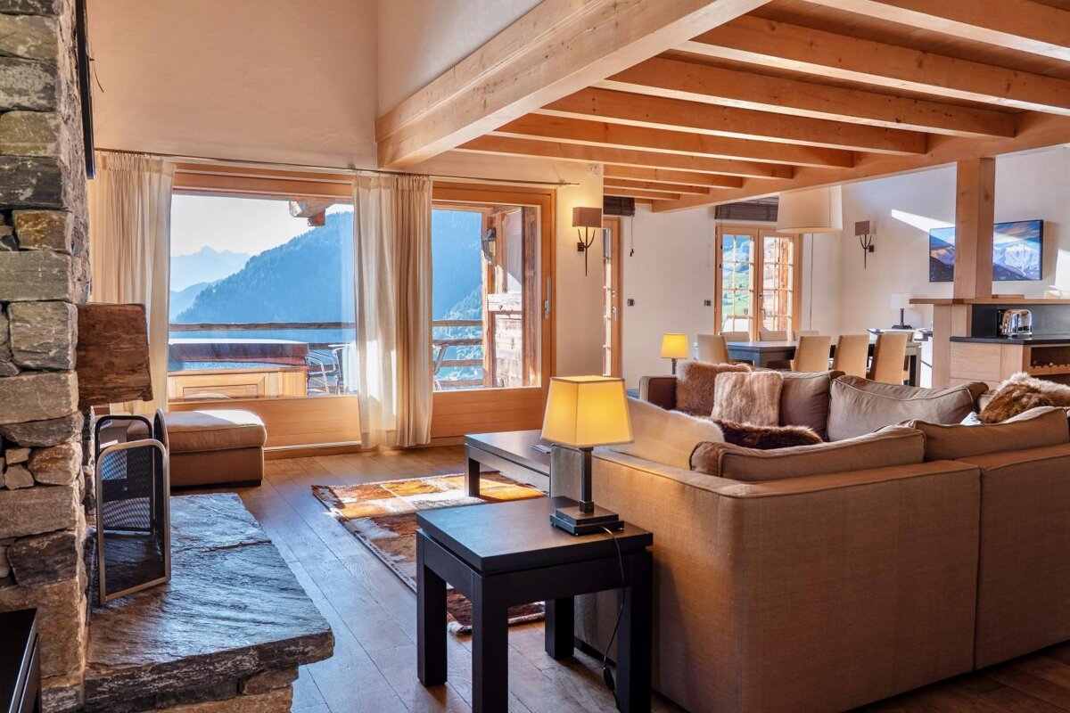 A living room with a couch and a fireplace