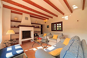 A living room with a fireplace and a couch