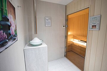 A sauna with a sign that says ' a sauna ' on it