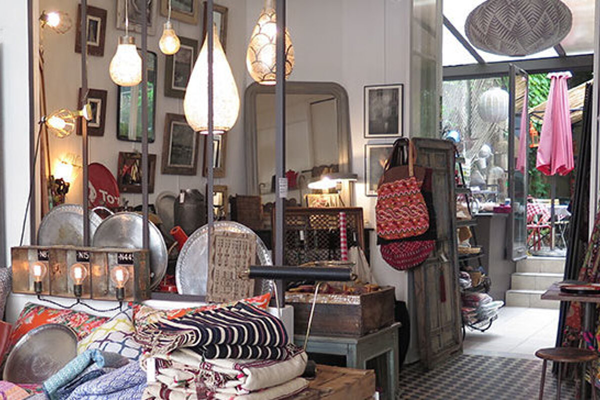 interior of a shop with outdoor cafe in anitbes