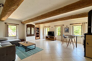 A living room with a couch and a television