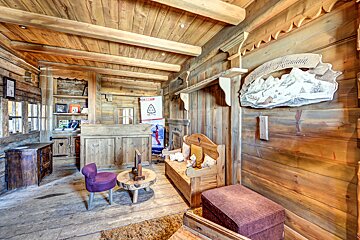 A wooden room with a sign that says grand mont blanc