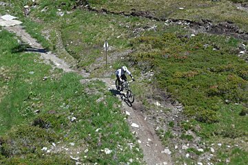 a jump on a mountain bike trail in le tour chamonix