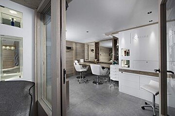 A salon with a sign that says ' sleek ' on it