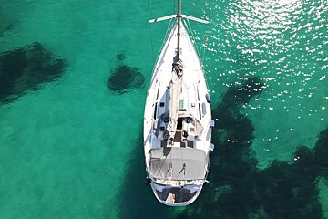 An aerial view of a sailboat in the ocean