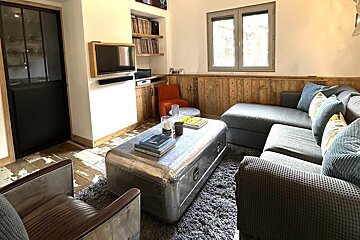 A living room with a couch and a coffee table