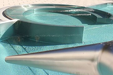 a silver feature in a heated swimming pool