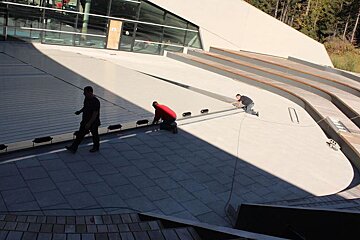 workmen in courchevel finishing off the swimming pool