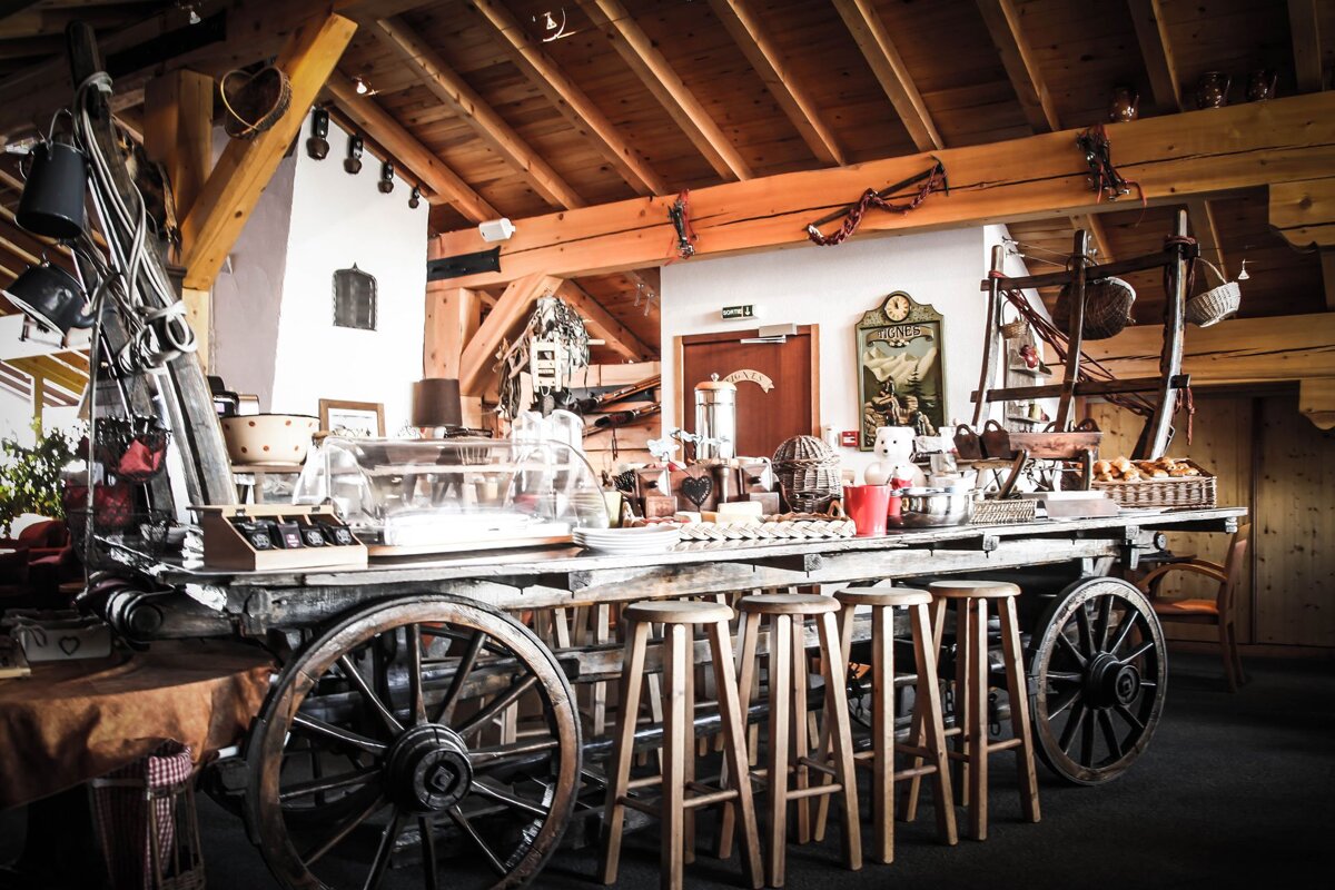 A wooden cart with a sign that says ' a ' on it