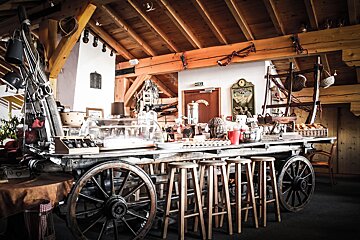 A wooden cart with a sign that says ' a ' on it