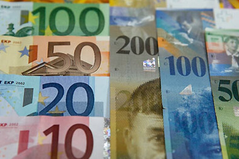 A stack of foreign currency including 100 50 20 and 10