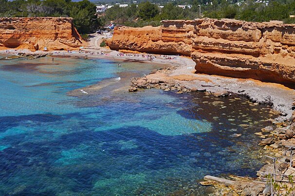Red rocks and blue waters of Sa Caleta ibiza